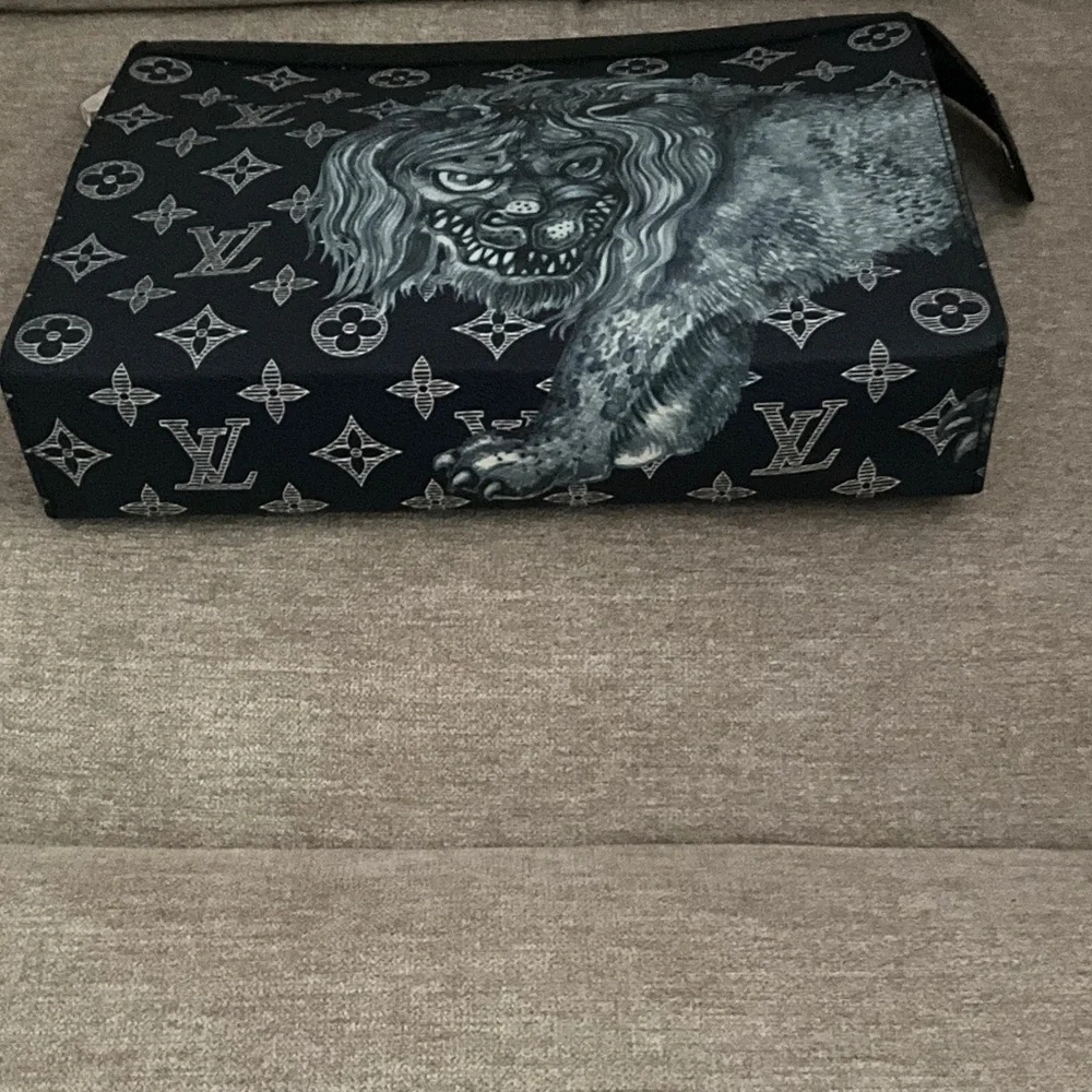 Louis Vuitton Chapman Lion Pochette Voyage